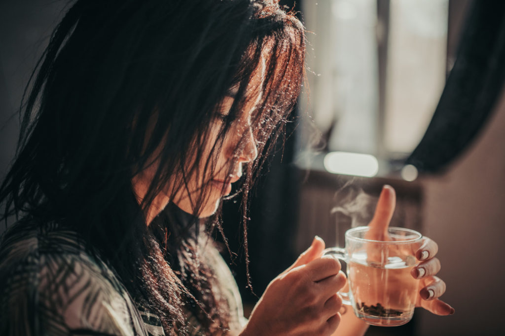 the girl enjoys tea and relaxation.