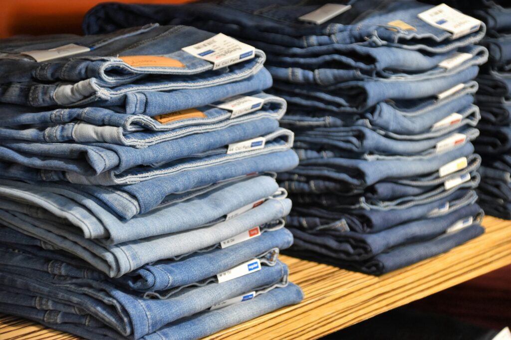 a pile of blue jeans