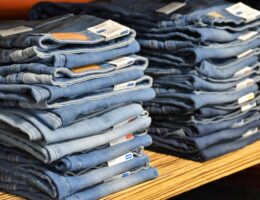 a pile of blue jeans