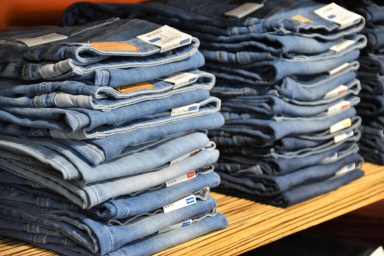 a pile of blue jeans